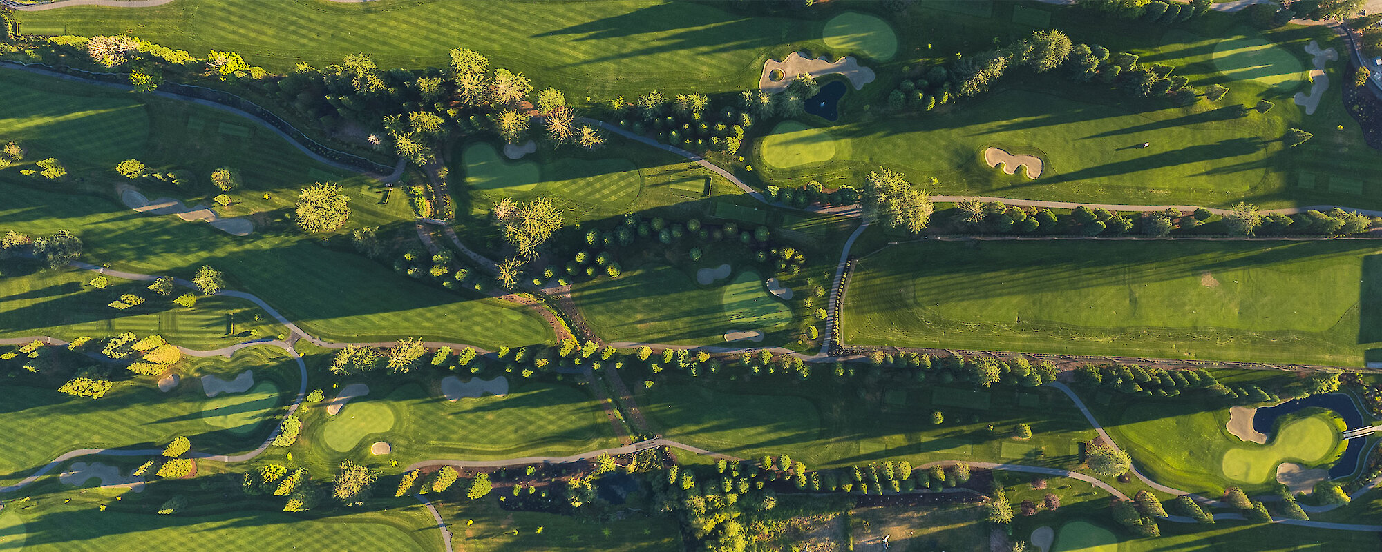 Aerial view of the golf course at sunrise
