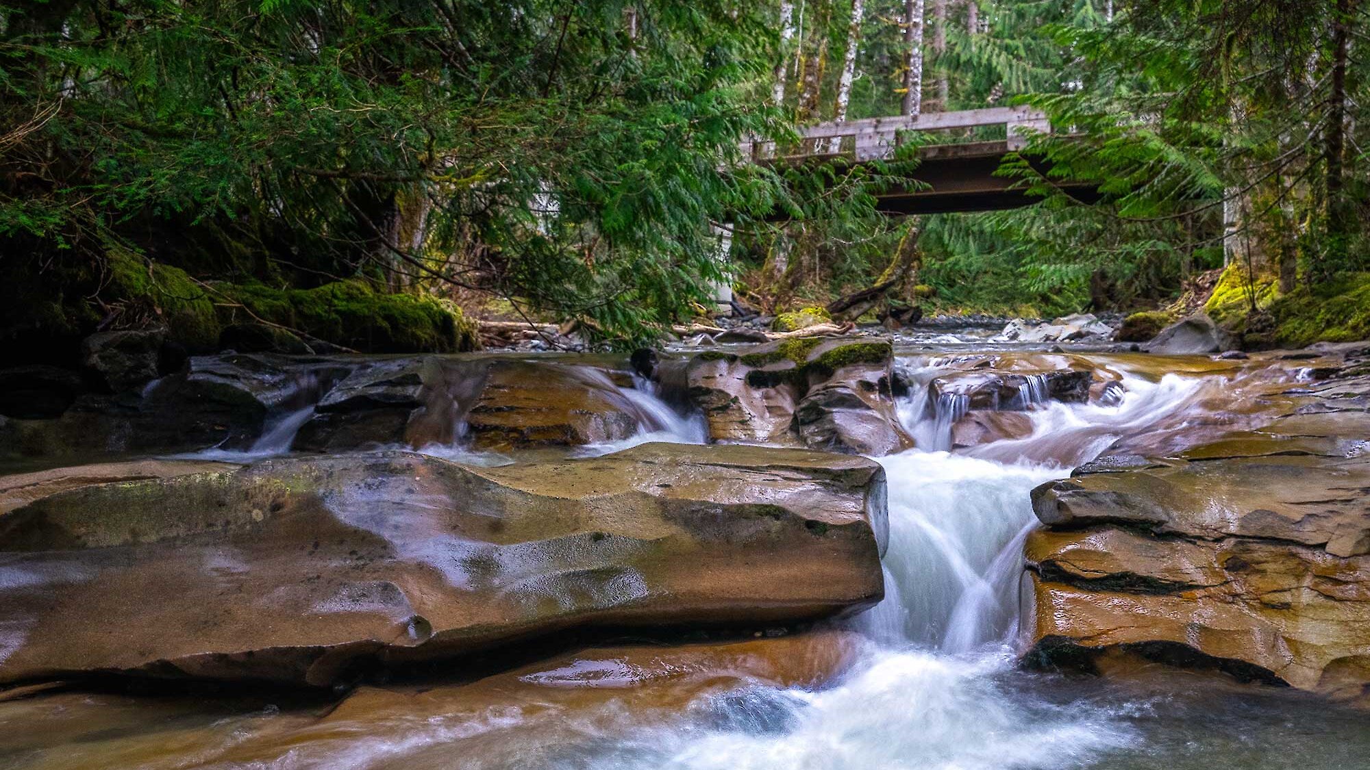 water flowing down a river through beautiful rock formations called potholes