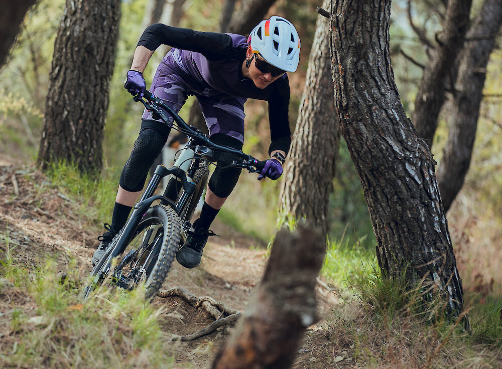 A woman bikes through the rainforest trails on Vancouver Island.