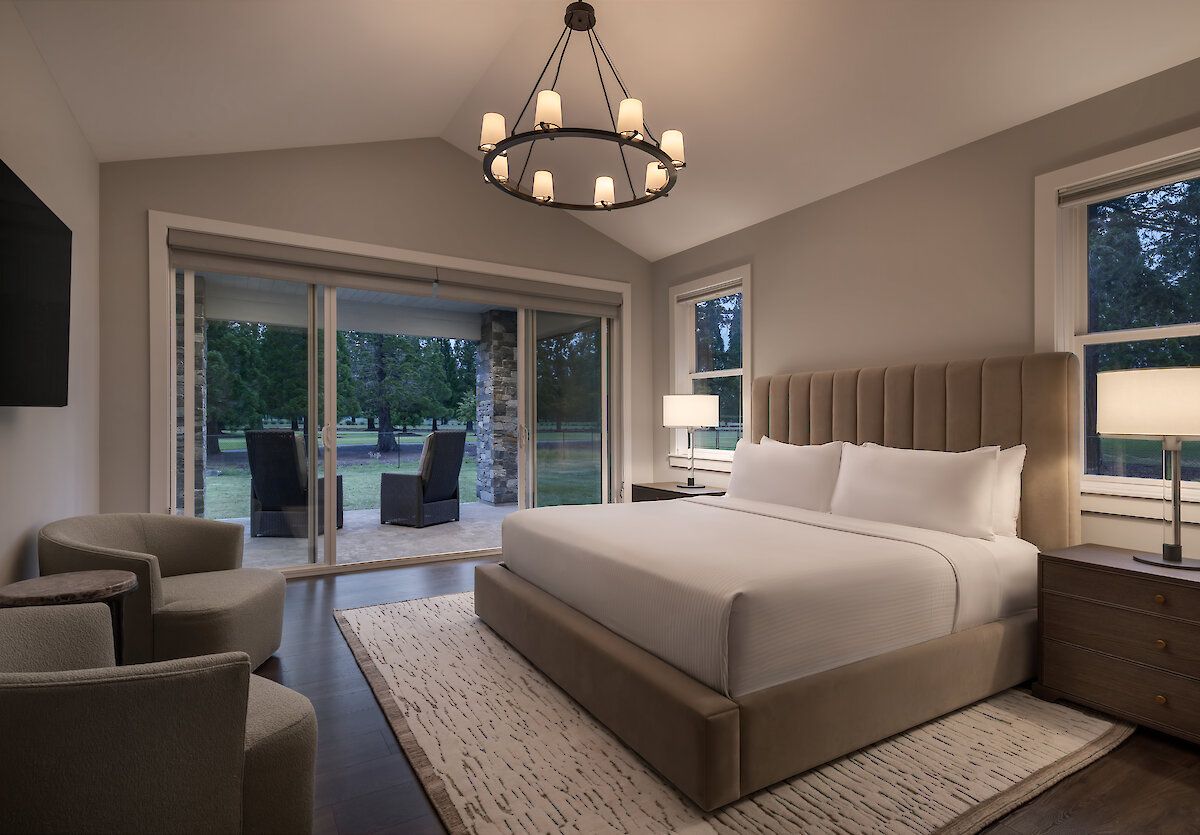 King bed with views out to the patio and golf course