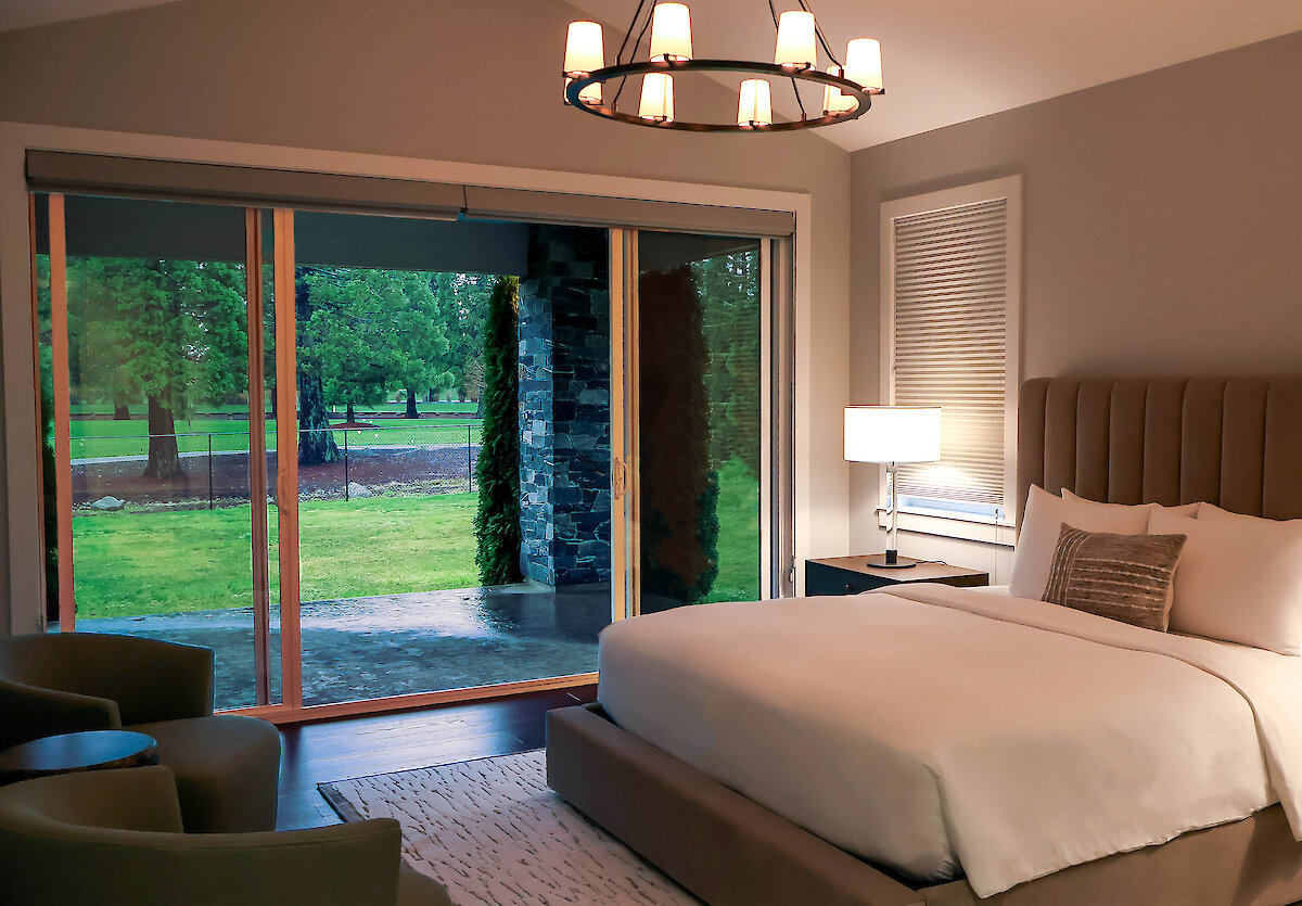 King bed with views out to the patio and golf course